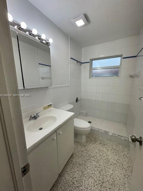 West Flagler Miami, FL 33126 - Photo 8 of 11 a bathroom with a sink a toilet and mirror