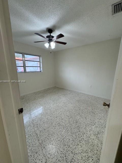West Flagler Miami, FL 33126 - Photo 9 of 11 en empty room with windows and fan