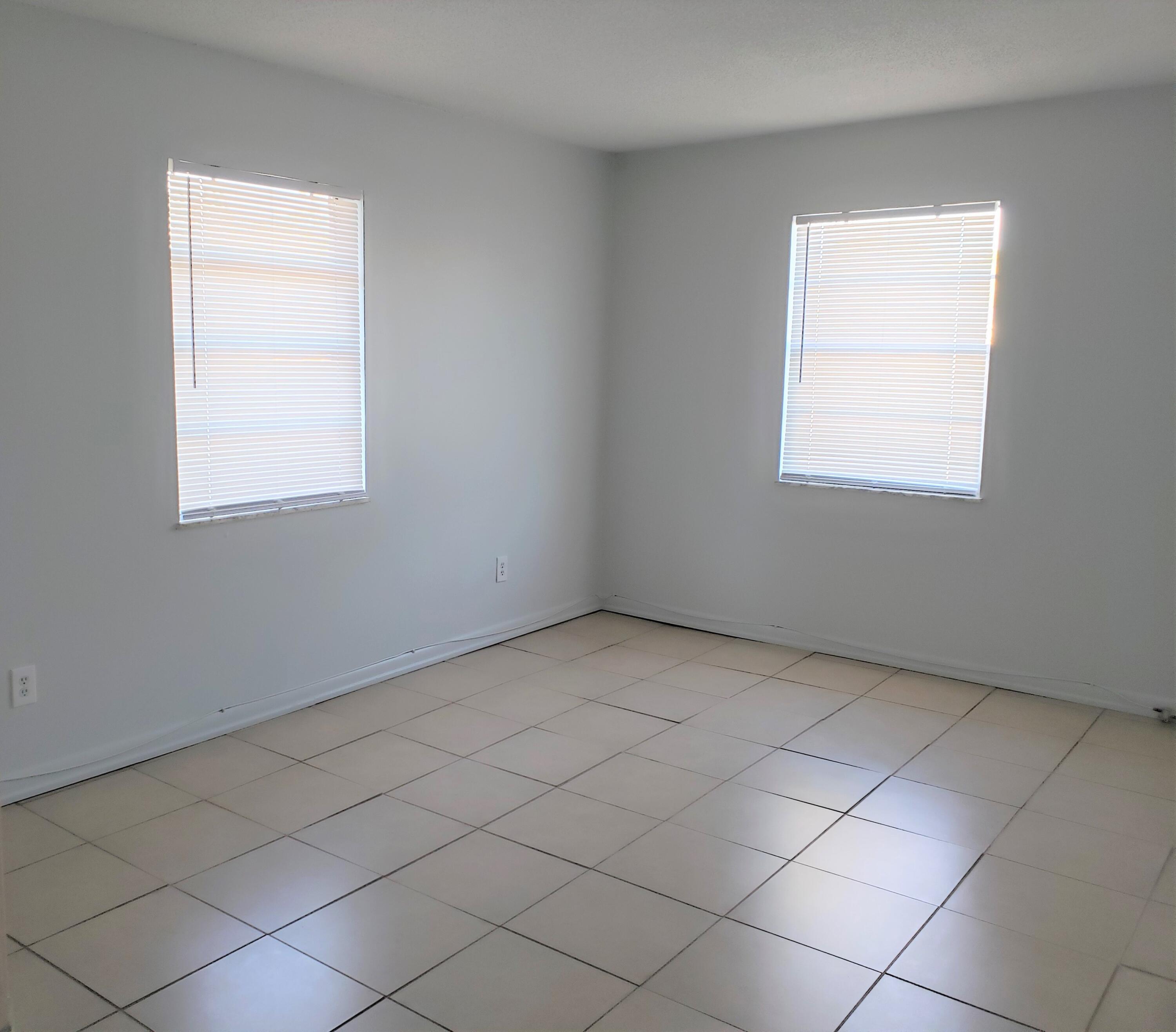 4752 Southeast Ebbtide Avenue, Unit 4752 Stuart, FL 34997 - Photo 3 of 8 an empty room with a window