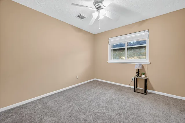 a bathroom with a toilet a sink and a mirror