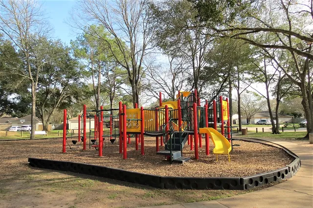 a view of a park with large trees