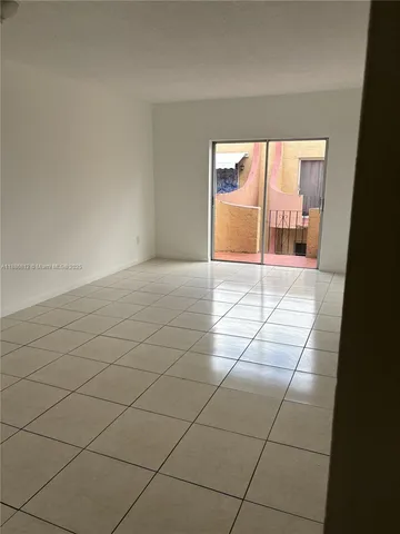 an empty room with a bathroom