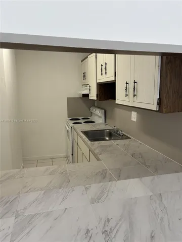 a room with a sink and a window