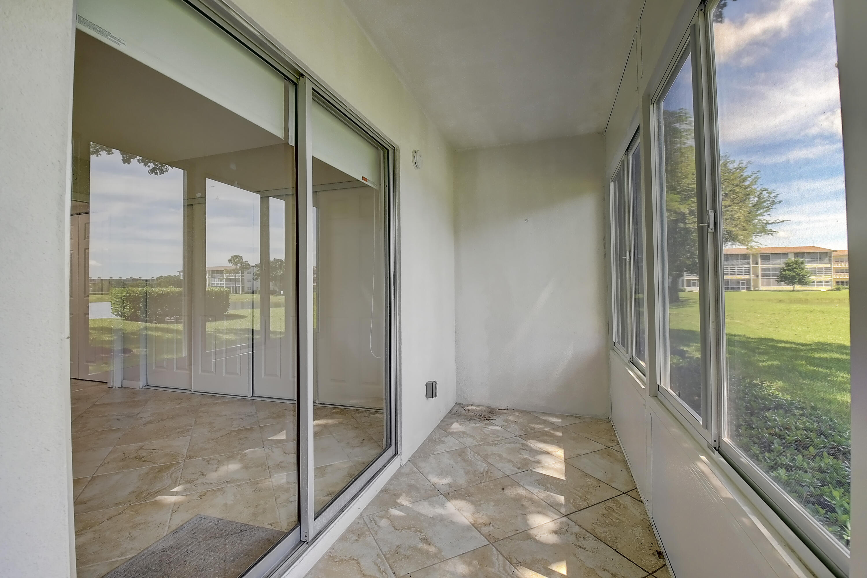 261 Preston Way, Unit G Boca Raton, FL 33434 - Photo 19 of 46 Screened patio