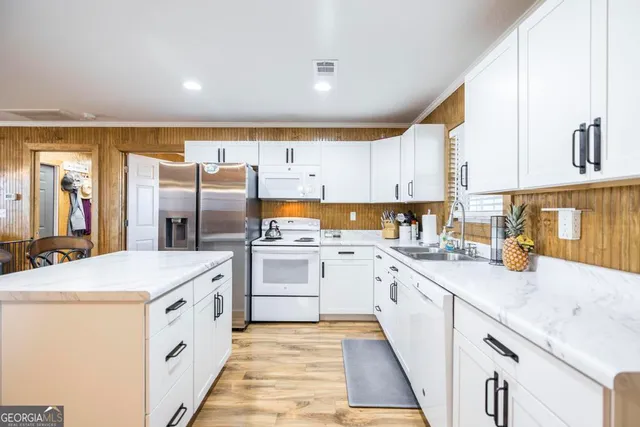 a kitchen with sink and window