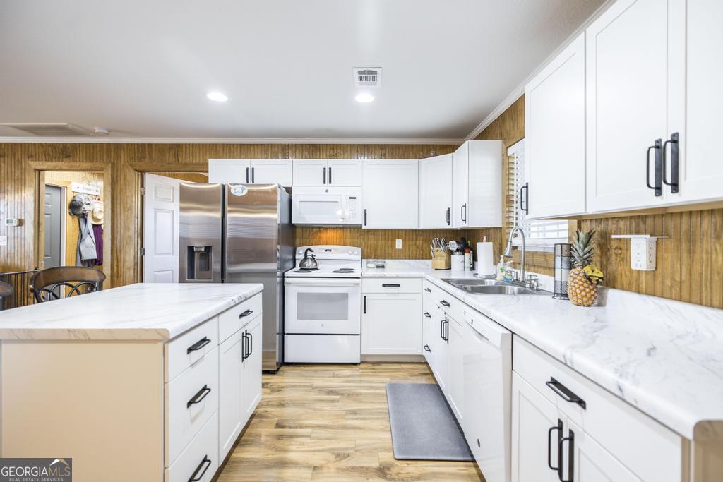 177 Lovett Scott Road Adrian, GA 31002 - Photo 11 of 37 a kitchen with a sink a stove and cabinets