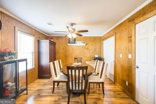 a view of a hallway with wooden furniture