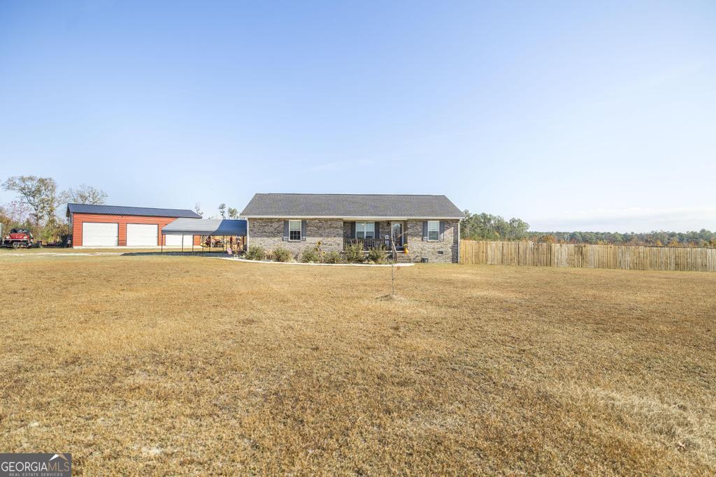 177 Lovett Scott Road Adrian, GA 31002 - Photo 2 of 37 a view of swimming pool with outdoor space and seating area