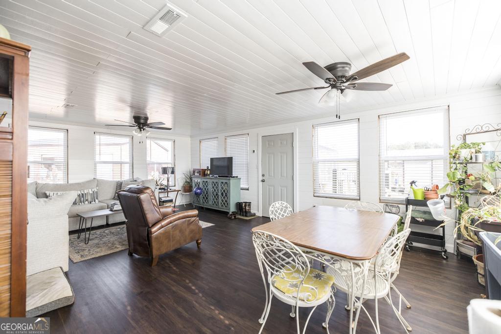 177 Lovett Scott Road Adrian, GA 31002 - Photo 22 of 37 a view of a dining room with furniture window and wooden floor