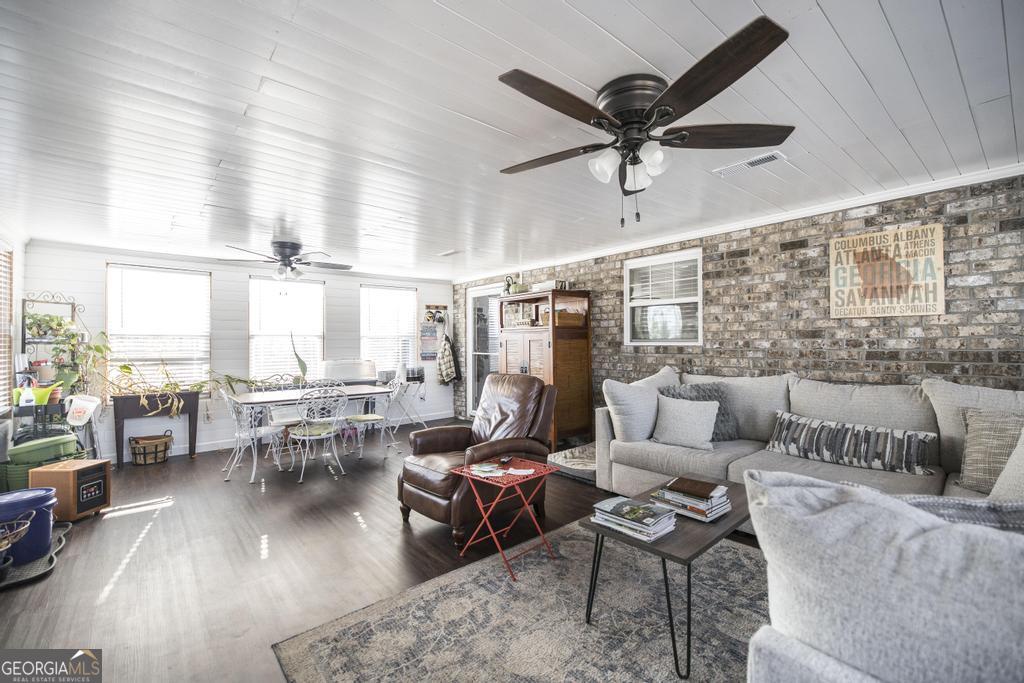 177 Lovett Scott Road Adrian, GA 31002 - Photo 23 of 37 a living room with furniture and a large window