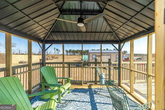 a view of a house with a yard and sitting area