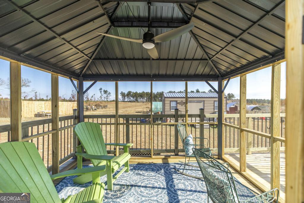 177 Lovett Scott Road Adrian, GA 31002 - Photo 25 of 37 a roof deck with outdoor seating