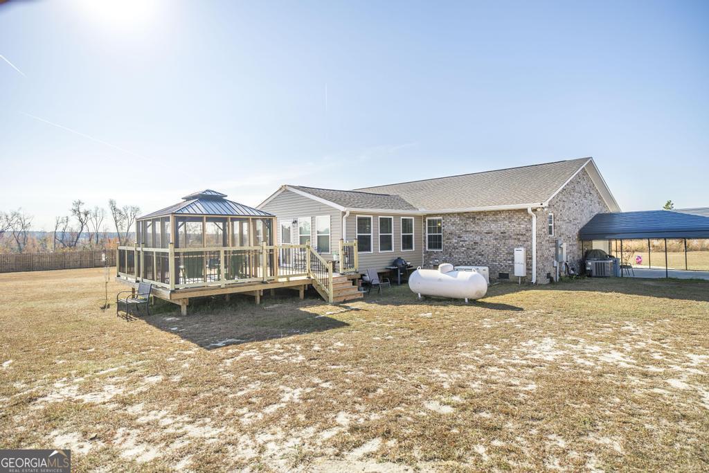 177 Lovett Scott Road Adrian, GA 31002 - Photo 26 of 37 a view of a house with swimming pool and sitting area