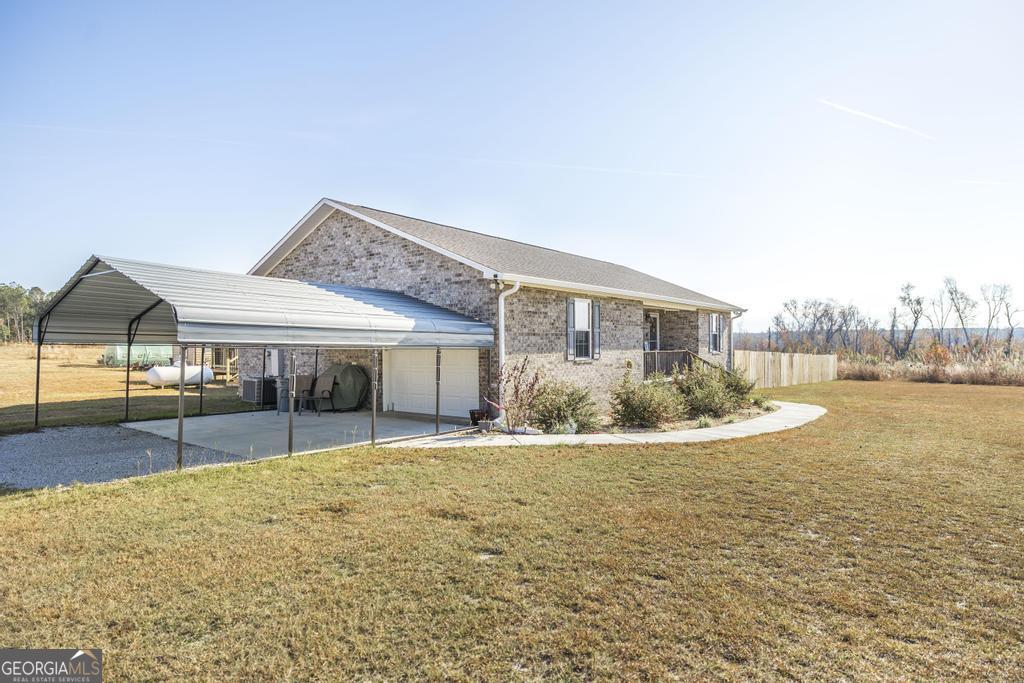 177 Lovett Scott Road Adrian, GA 31002 - Photo 4 of 37 a view of a house with swimming pool