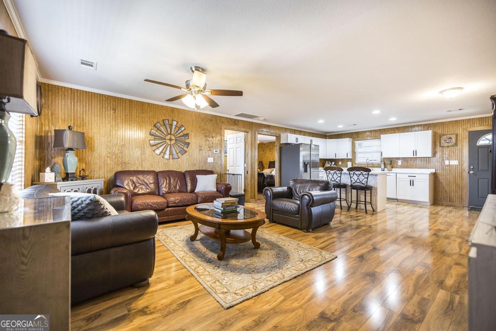 177 Lovett Scott Road Adrian, GA 31002 - Photo 6 of 37 a living room with furniture and kitchen view
