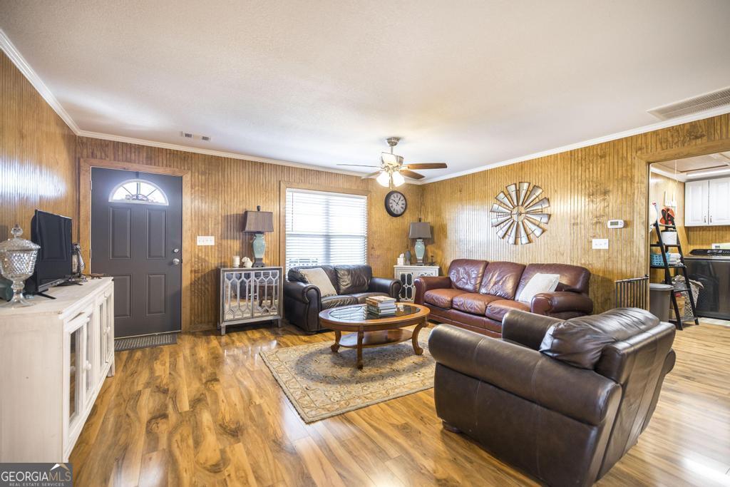 177 Lovett Scott Road Adrian, GA 31002 - Photo 7 of 37 a living room with furniture and a flat screen tv