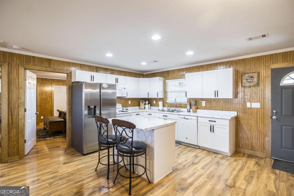 177 Lovett Scott Road Adrian, GA 31002 - Photo 10 of 37 a kitchen with a refrigerator and a stove top oven