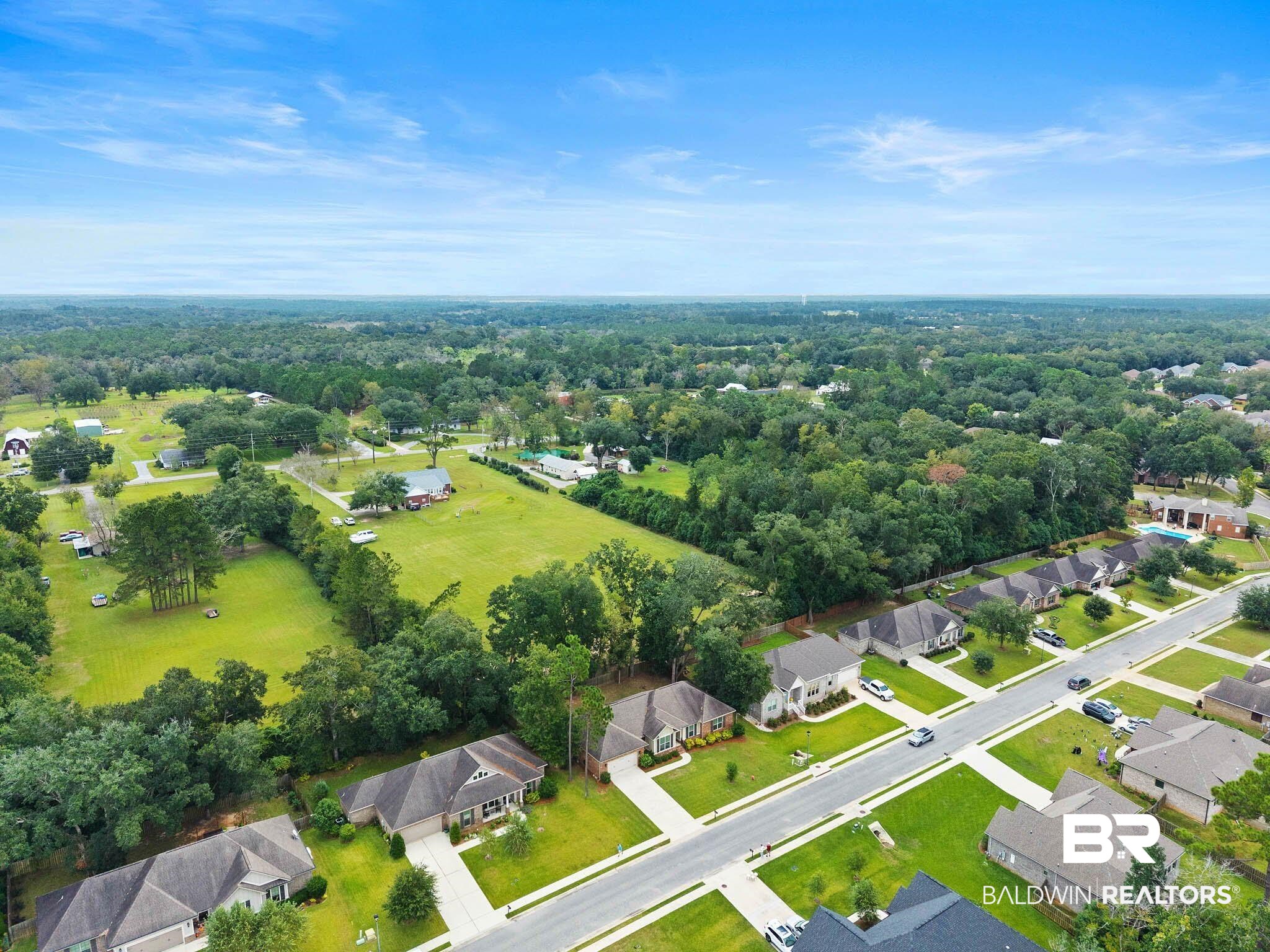 19740 Bunker Loop Fairhope, AL 36532 - Photo 32 of 33 Aerial perspective of suburban area featuring a heavily wooded area