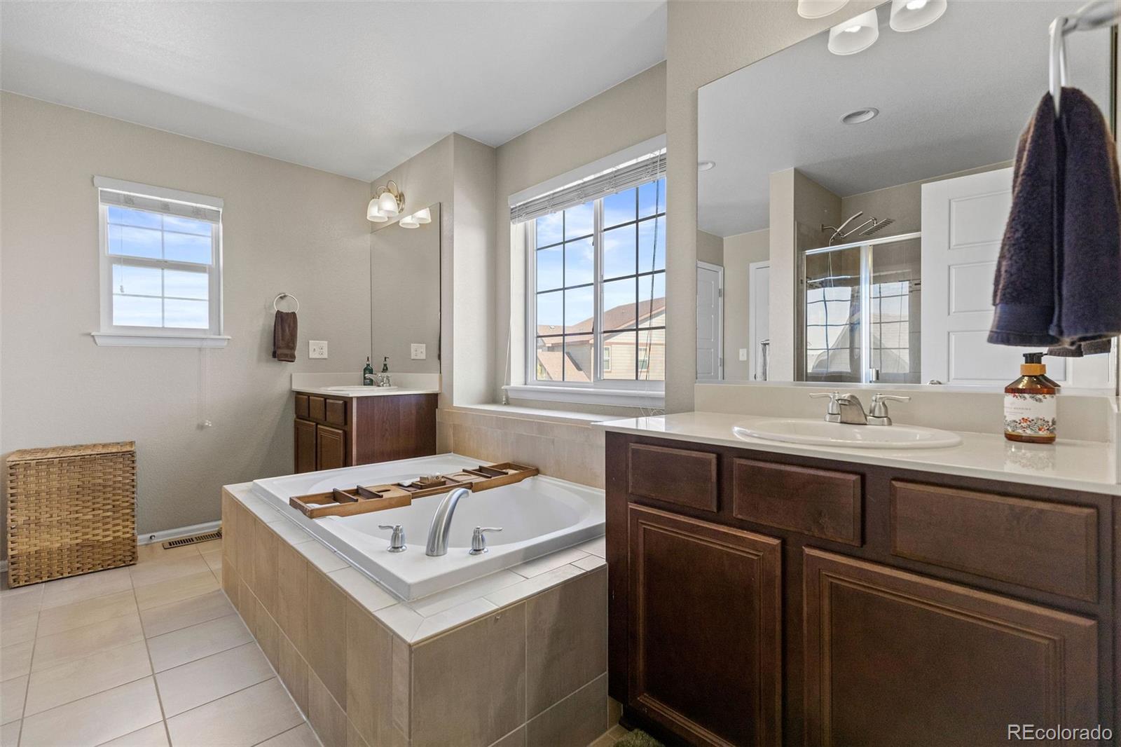 10039 Buttesfield Street Firestone, CO 80504 - Photo 14 of 35 a bathroom with a sink and a mirror