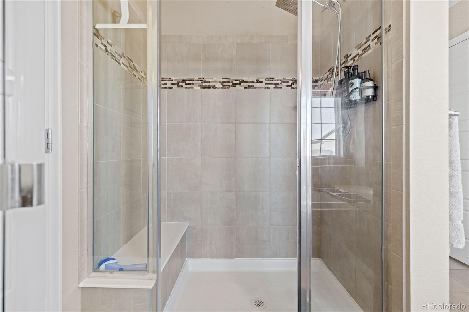 10039 Buttesfield Street Firestone, CO 80504 - Photo 16 of 35 a bathroom with a shower