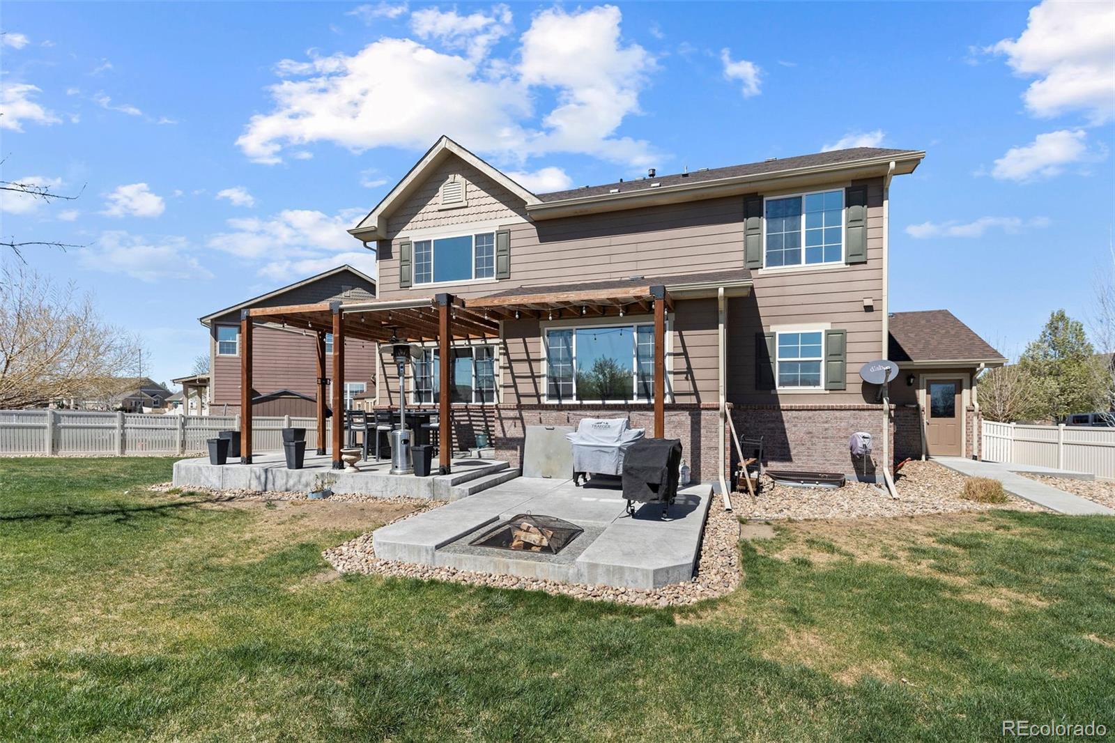 10039 Buttesfield Street Firestone, CO 80504 - Photo 2 of 35 a view of a house with a patio