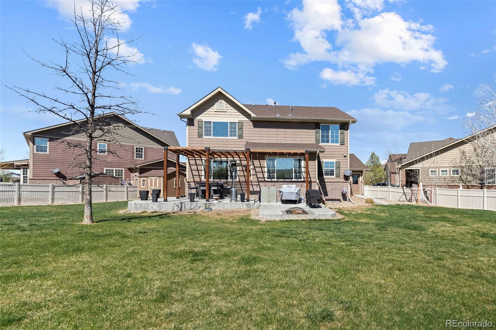 10039 Buttesfield Street Firestone, CO 80504 - Photo 29 of 35 a front view of a house with garden