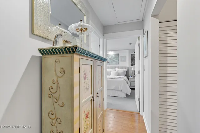 a view of a hallway to a livingroom and a hallway