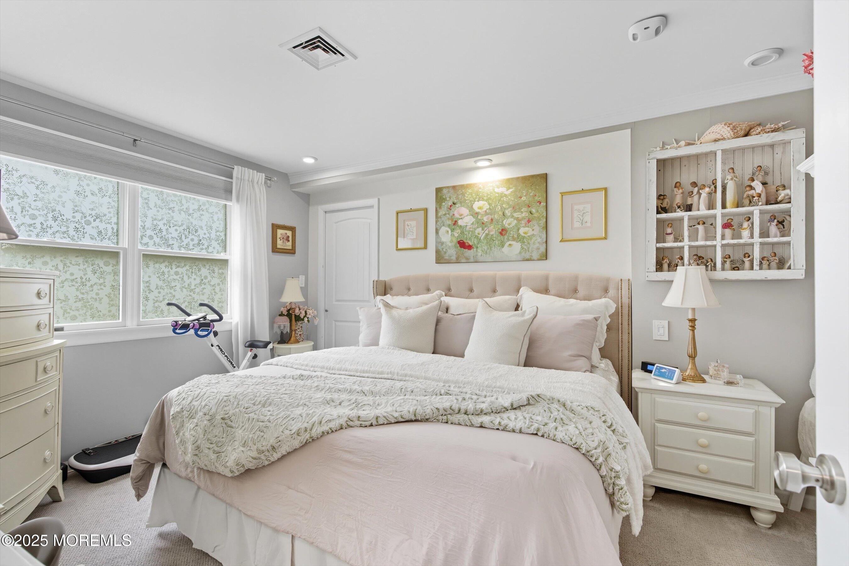 219 Lexington Drive Little Egg Harbor, NJ 08087 - Photo 11 of 30 a bedroom with a bed and a window