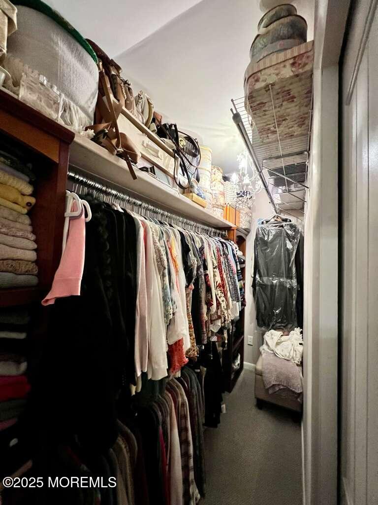 219 Lexington Drive Little Egg Harbor, NJ 08087 - Photo 12 of 30 a view of walk in closet with clothes and shoes