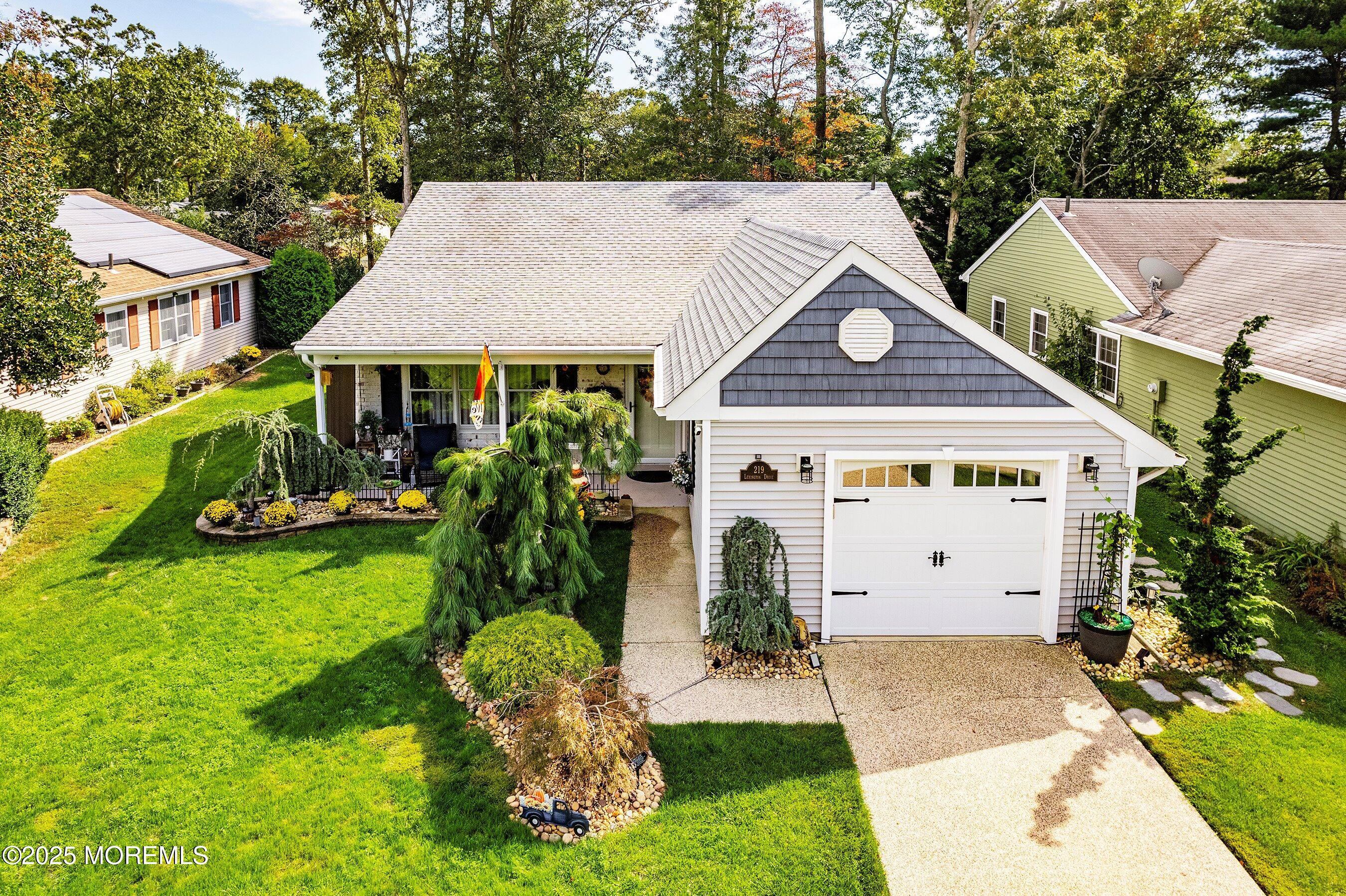 219 Lexington Drive Little Egg Harbor, NJ 08087 - Photo 2 of 30 a front view of house with yard and green space