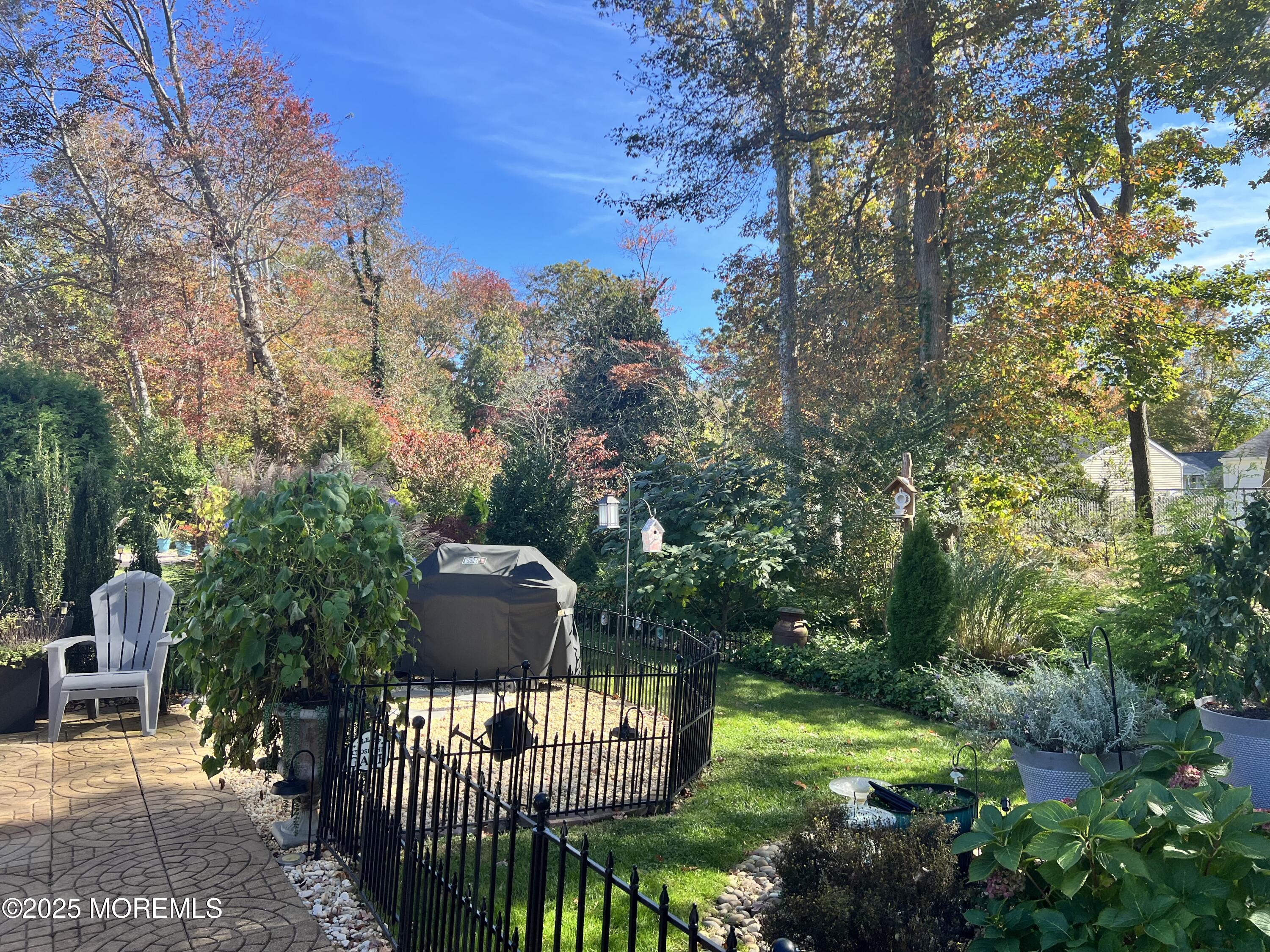 219 Lexington Drive Little Egg Harbor, NJ 08087 - Photo 21 of 30 a view of a wooden dinning table and chairs in the patio