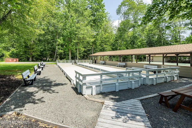 a view of a swimming pool with an outdoor space and seating area