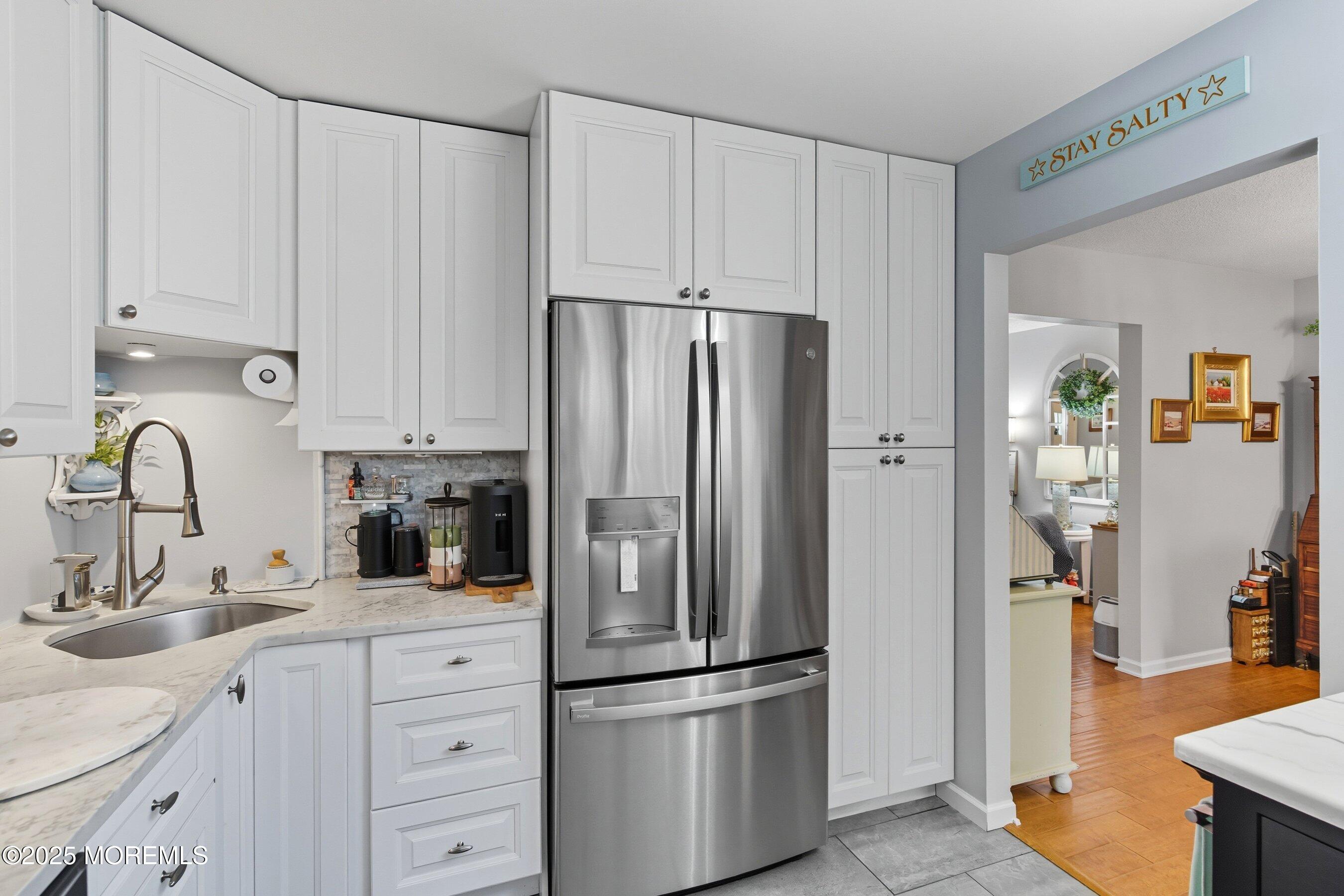 219 Lexington Drive Little Egg Harbor, NJ 08087 - Photo 7 of 30 a kitchen with appliances a sink and cabinets