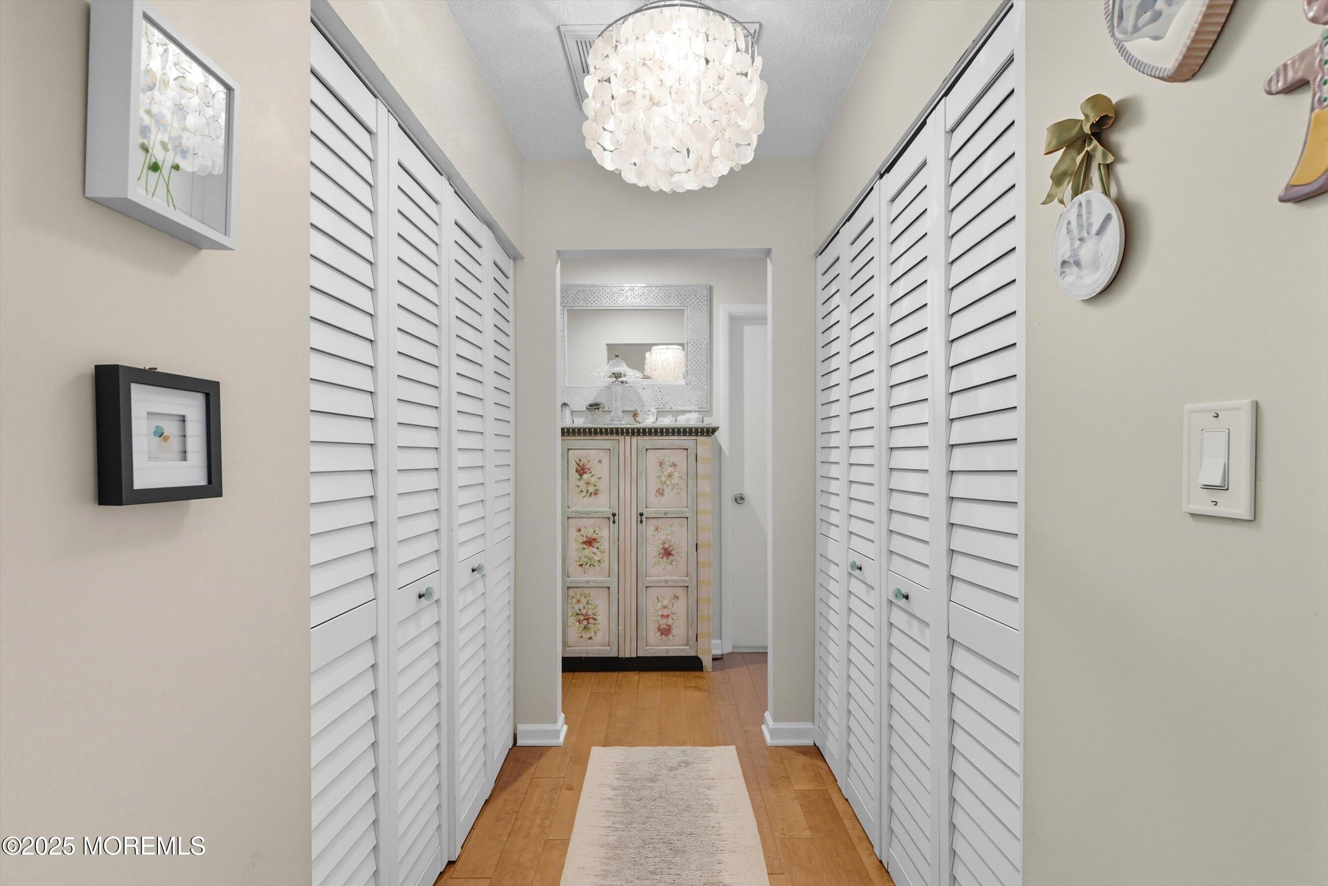 219 Lexington Drive Little Egg Harbor, NJ 08087 - Photo 9 of 30 a view of a hallway with chandelier
