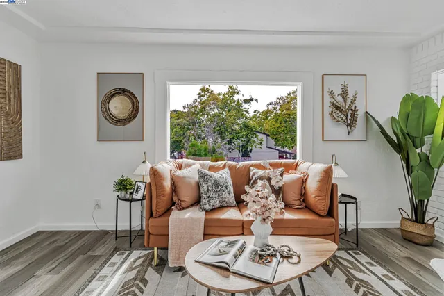 a kitchen with stainless steel appliances granite countertop a stove a refrigerator and a white cabinets