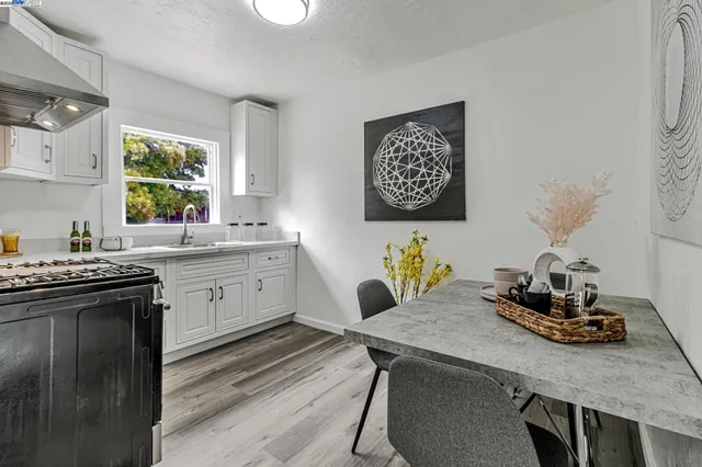 a workspace with a couch and a potted plant