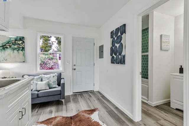 a bedroom with furniture and a window