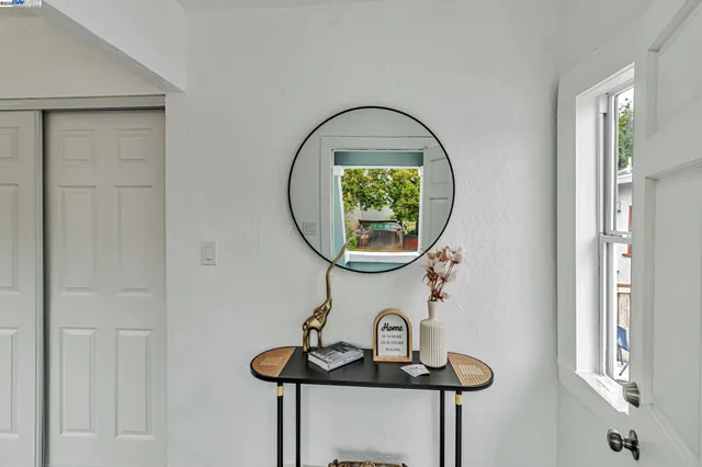 a bathroom with a mirror and a sink