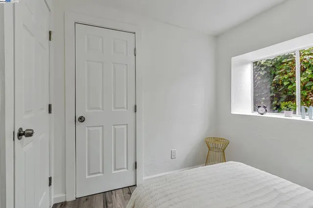 a view of a bedroom with a bed