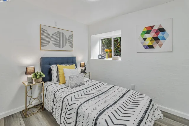 a bedroom with bed and a window