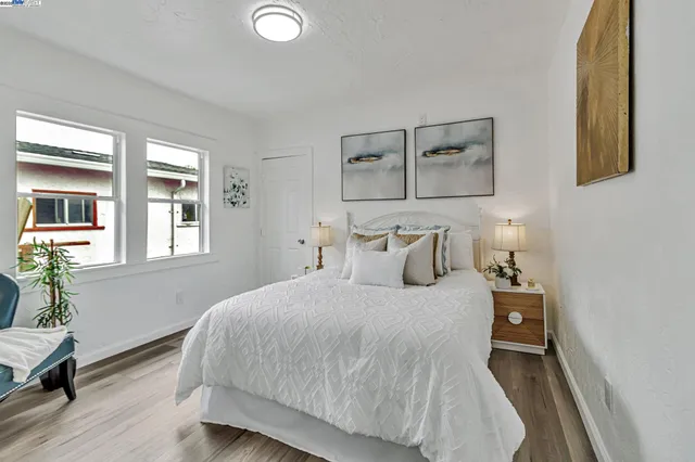 a bedroom with a large bed and a window