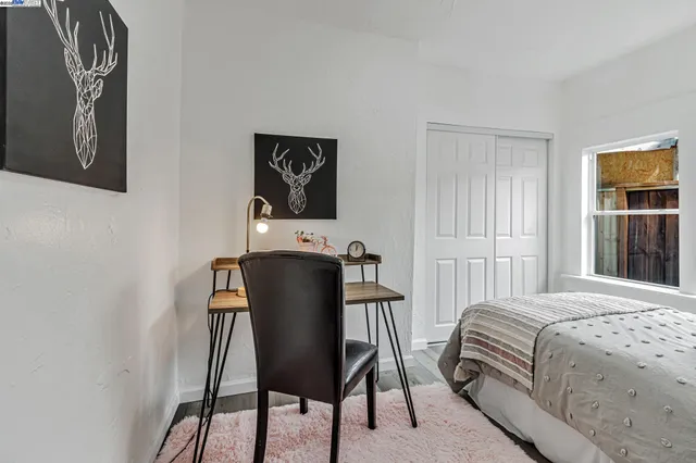 a bathroom with a toilet sink vanity tub and shower