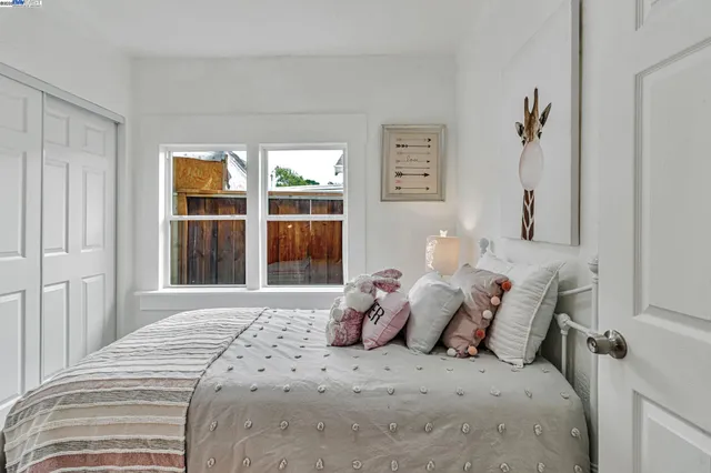 a bathroom with a toilet a sink and a window