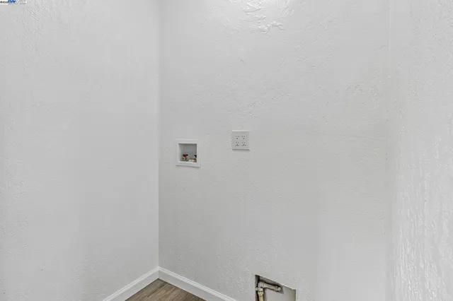 a view of a patio with a table and chairs