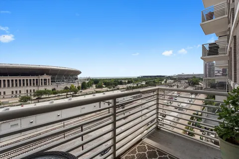 a bedroom with a bed and a dresser in it
