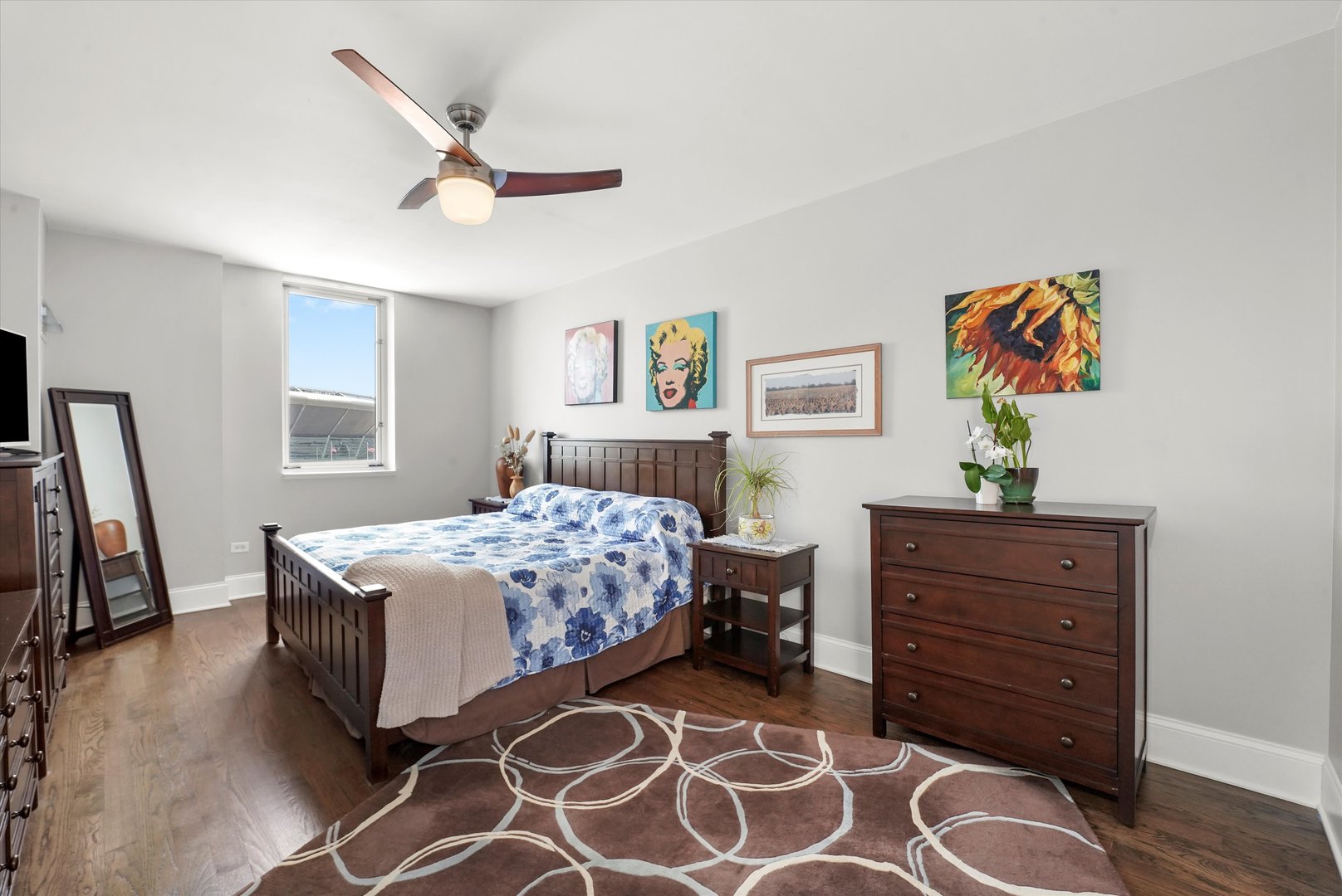 1515 South Prairie Avenue, Unit 910 Chicago, IL 60605 - Photo 13 of 32 a bedroom with a bed and a dresser in it