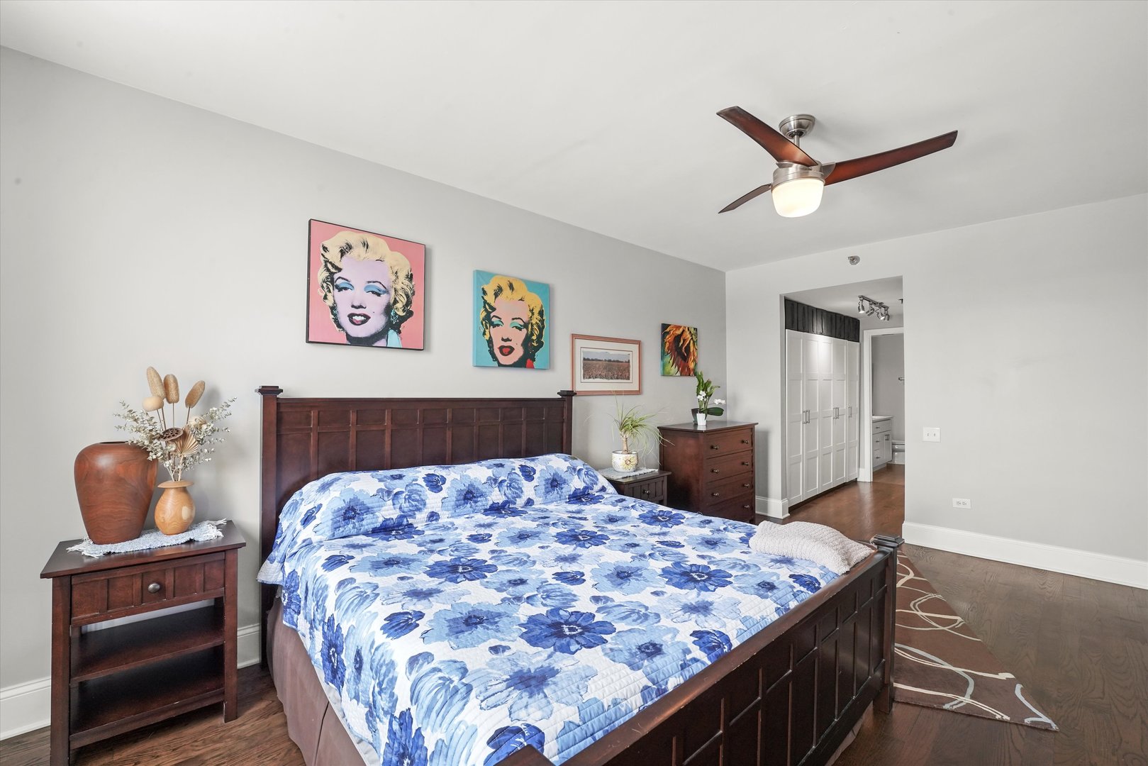 1515 South Prairie Avenue, Unit 910 Chicago, IL 60605 - Photo 14 of 32 a bedroom with a bed and wooden floor