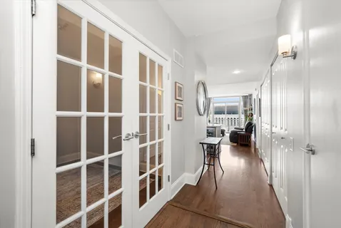 a view of a street with wooden benches