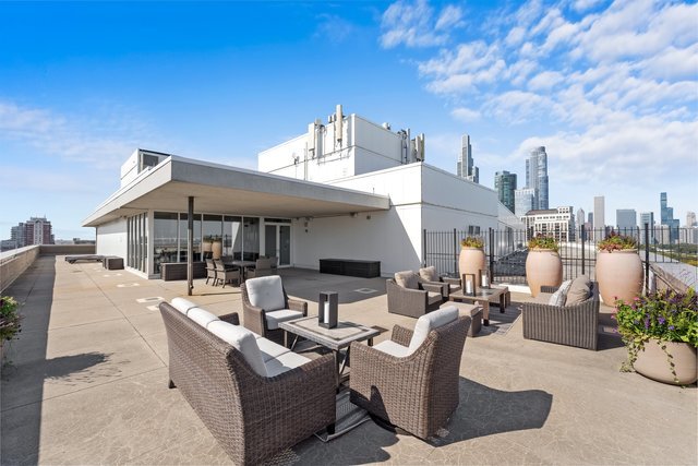 1515 South Prairie Avenue, Unit 910 Chicago, IL 60605 - Photo 27 of 32 a view of a patio with couches and potted plants
