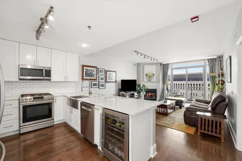 a open kitchen with sink stove and refrigerator